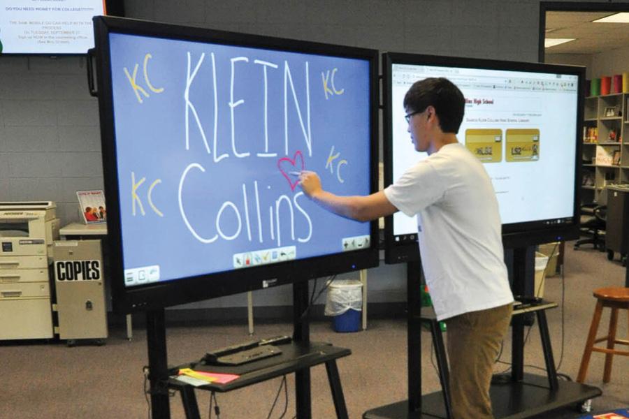 While using the new library technology, senior Kevin Huang doodles a heart. “I like the new technology because it is more interactive and visual,” Huang said.