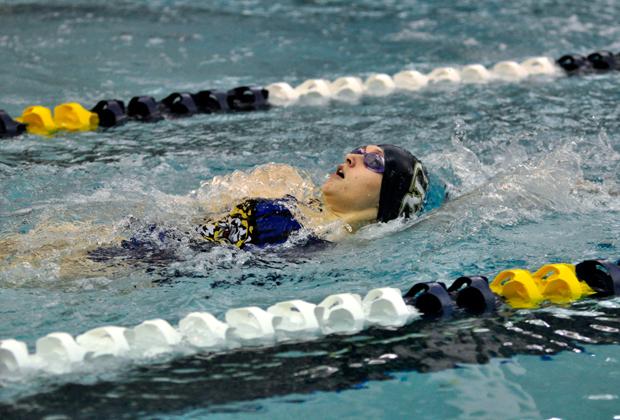 Sarah Chambers practices to maintain her strength as the only senior girl on the varsity swim team.