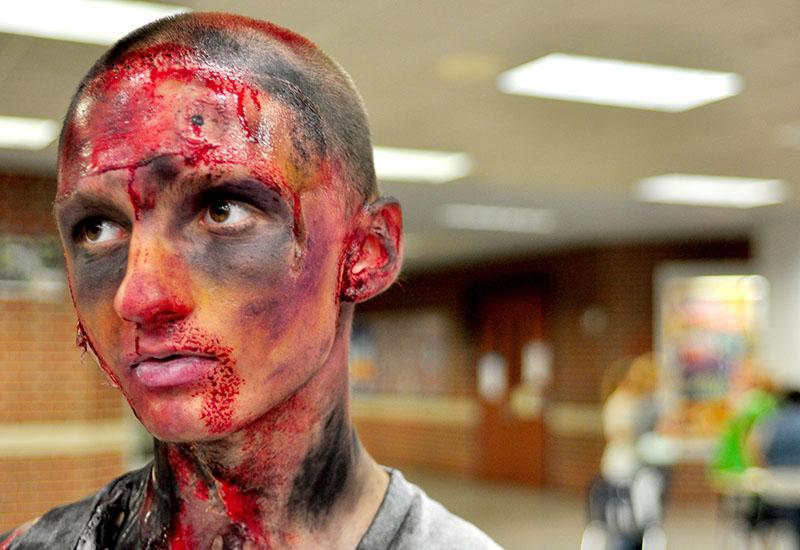 Junior Collin Kloth decorated his face for the ROTC Halloween party.