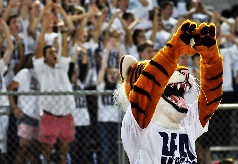 The tiger mascot cheers along with the crowd for White Out night.