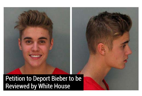 After being charged with DUI and drag racing, a smiling Justin Bieber poses for a mugshot.