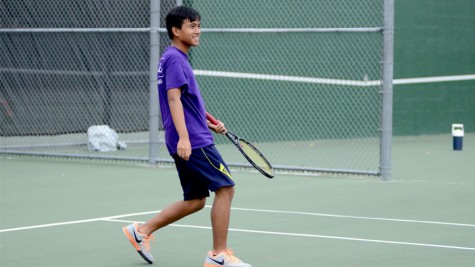 Junior Ralph Lee practices, working to perfect his tennis skills.