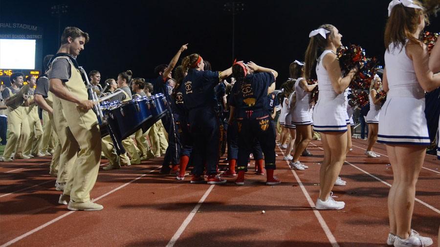 Drum line, Collins Crew and varsity cheerleaders all try to hype up the crowd together.