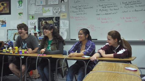 Seniors Iain Mackenzie, Peyton Pritchard, Christine Palma and Amy Moynihan prepare for competition by doing mock rounds on buzzer machines.