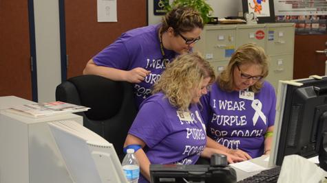 Students and faculty member all wear purple to support Coach Scott.