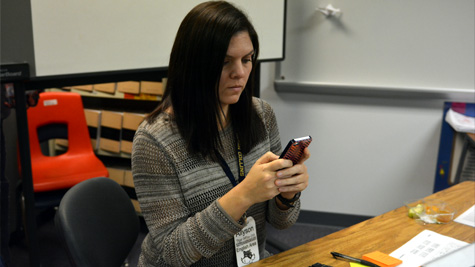 English Department Chair Laurie Marek uses the "Remind" app to send students reminders for assignments.