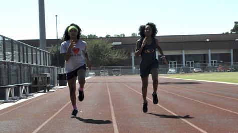 Twins Katiana and Ariana Pulido practice on the track together after school.