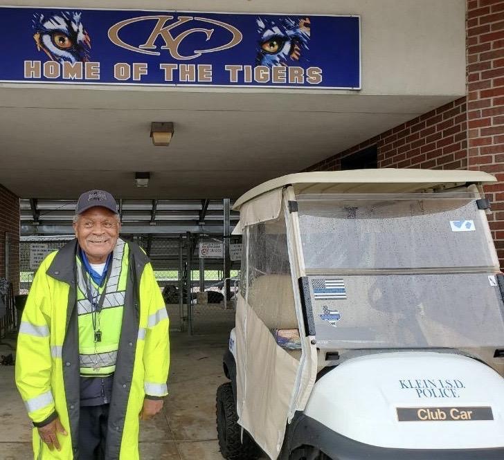 Henry Thaxton smiles as he gets ready to greet students and staff at Klein Collins High School.