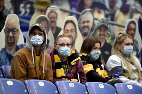  In this Nov. 1, 2020, file photo, spectators wear face masks to protect against COVID-19 during the first half of an NFL football game between the Baltimore Ravens and the Pittsburgh Steelers, in Baltimore. 