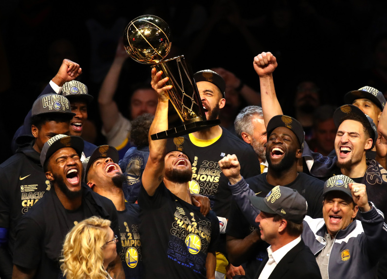 CLEVELAND, OH - JUNE 08:  Stephen Curry #30 of the Golden State Warriors celebrates with the Larry OBrien Trophy after defeating the Cleveland Cavaliers during Game Four of the 2018 NBA Finals at Quicken Loans Arena on June 8, 2018 in Cleveland, Ohio. The Warriors defeated the Cavaliers 108-85 to win the 2018 NBA Finals. NOTE TO USER: User expressly acknowledges and agrees that, by downloading and or using this photograph, User is consenting to the terms and conditions of the Getty Images License Agreement.  (Photo by Justin K. Aller/Getty Images)