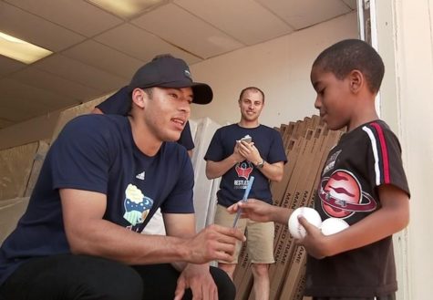 Carlos Correa handing out mattresses to kids who lost theirs in flood.