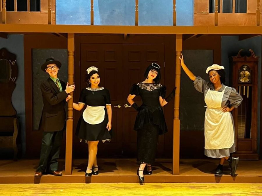 Jackson Luikens as Mr. Green, Nadine Hamad as Yvette the maid, Kennedy Hayes as Mrs. White, and Taylor Washington as the cook. Theatre students star in the current production of Clue with different endings every night of the performance.
